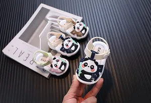 Close-up of adorable cartoon panda sandals for toddlers with soft protective soles