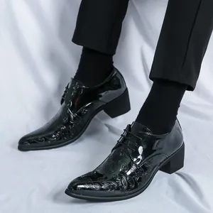 Stylish men's pointed patent leather dress shoes with Paisley embossing and block heels.
