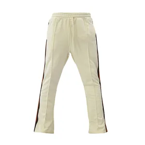 Men's stylish retro flared track pants featuring contrast side stripes in cream.