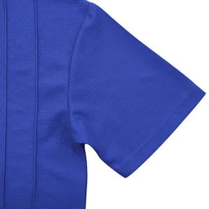 Close-up macro view of blue waffle knit fabric texture on a men's short sleeve shirt