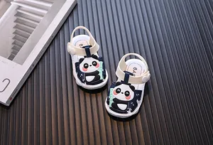 Close-up detail of infant summer sandals featuring a cute cartoon panda and bamboo design