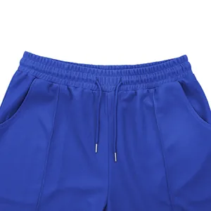 Detail view of men's blue waffle knit shorts showing elastic drawstring waist