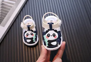 Close-up detail of cute cartoon panda baby sandals with soft anti-slip soles for toddlers