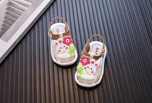 Detailed view of cute toddler girls' sandals with white rabbit and red flower decor