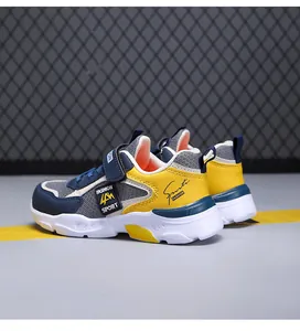 Detailed side view of boy's lightweight mesh sneakers in yellow and blue colors