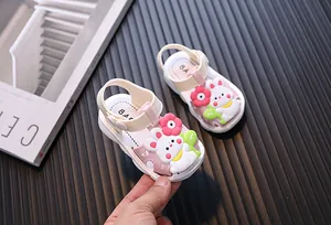 Close-up of cute pink baby girl sandals with 3D cartoon rabbit and flower