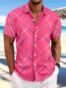 Detail of men's pink short-sleeved beach shirt with vibrant criss-cross pattern.