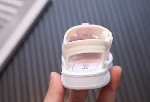 Close-up back view of pink toddler girl summer sandals with soft cushioned heel