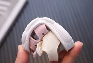 Close-up of flexible soft sole toddler sandal showing its bendability and durability