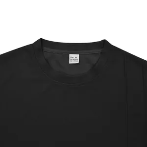 Macro shot of black waffle knit crew neck featuring the size M and material label.