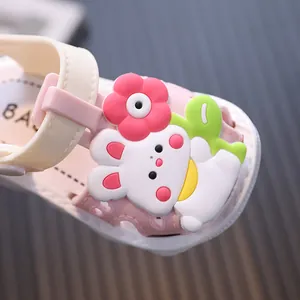 Pink toddler girl sandals with cute cartoon bunny and flower decoration, close-up view