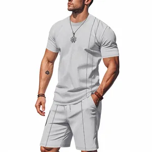 Detailed view of the waffle knit texture on this light gray men's two-piece set.