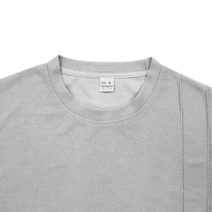 Macro detail of gray waffle knit crew neck t-shirt collar and texture for men