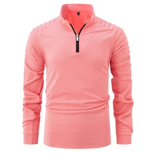 Pink long sleeve half-zip sports shirt with unique pleated shoulder and sleeve details
