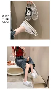 Detailed view of women's white platform sneakers decorated with sparkling rhinestones