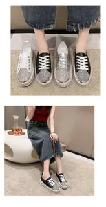 Close-up detail of rhinestone platform sneakers with lace-up design and thick soles
