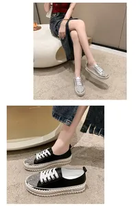 Detail view of stylish rhinestone platform sneakers for women in silver and black colors.