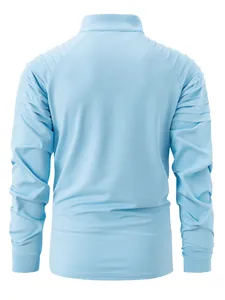 Detail view of the back of a men's light blue athletic zip-up shirt with pleated shoulders.