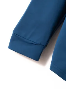 Close-up macro detail of the ribbed cuff on a men's navy blue casual sports long sleeve shirt