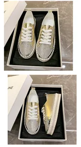 Sparkling gold rhinestone platform sneakers for women displayed in a luxury gift box