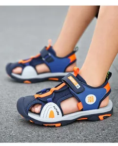 Detailed side view of breathable kids closed-toe sandals in blue and orange sport style