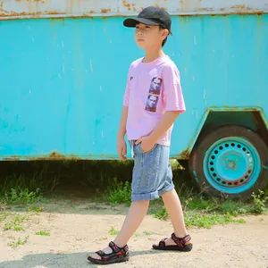 Boy's lightweight black and red sports sandals for summer outdoor beach activities.