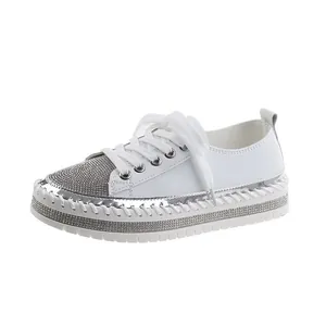 Fashionable white platform sneakers for women featuring sparkling silver rhinestone accents