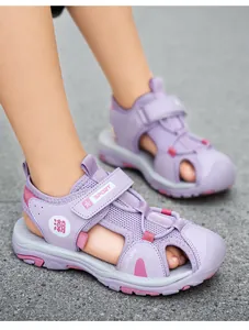 Close-up detail of purple mesh closed-toe sandals for kids showing velcro strap and design.