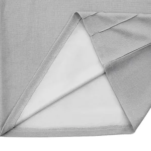 Close-up of grey waffle knit fabric with breathable white mesh lining detail view