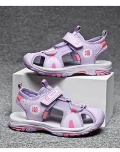 Detail of purple and pink kids' closed-toe sandals with mesh and Velcro.