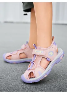 Close-up detail of children's pink and purple closed-toe sport sandals for summer