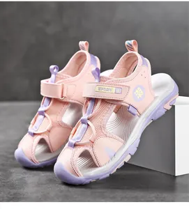 Detailed view of pink and purple kids' closed-toe beach sandals with breathable mesh.