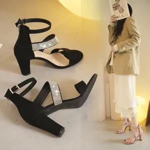 Black and pink chunky heel sandals with rhinestone cross straps and ankle closure
