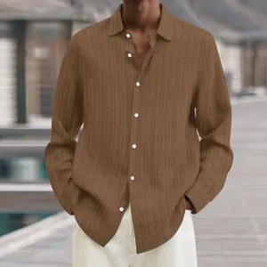 Close-up of a men's brown ribbed long-sleeve casual shirt featuring white buttons.