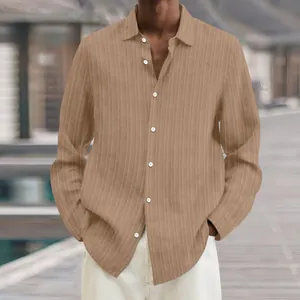 Detailed view of men's casual long-sleeved ribbed shirt in khaki with stylish white buttons