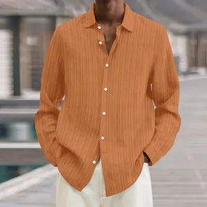 Detail view of men's orange ribbed long-sleeve casual shirt with lapel and white buttons.