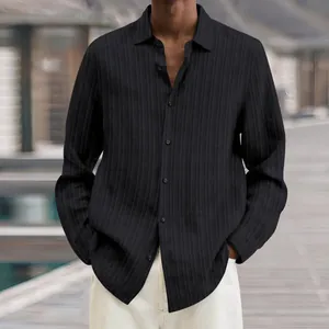 Close-up detail of a men's black ribbed casual long-sleeved shirt featuring a button-up front