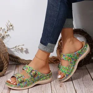Close-up of colorful woven grid pattern on women's slippers with double buckles