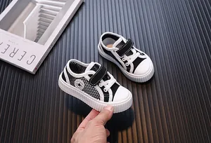 Close-up detail of breathable mesh toddler sneakers with durable rubber soles