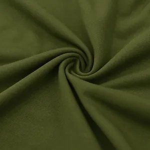 Detailed macro view of olive green breathable quick-dry polo shirt fabric texture