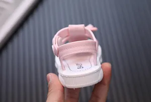 Detailed back view of pink baby girl sandals with adjustable strap and soft sole