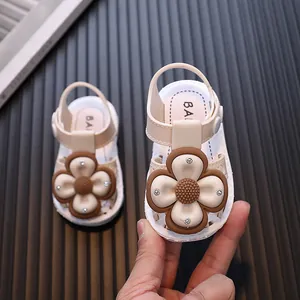 Cute beige baby girl summer sandals featuring a large 3D flower and closed-toe design.