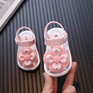 Pink baby girl sandals with large flower and rhinestone accents, 0-3 years