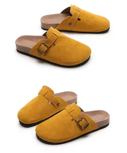 Close-up of mustard yellow suede cork mules with adjustable buckle strap detail