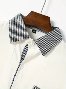 Close-up of men's white shirt featuring a classic black and white houndstooth collar.