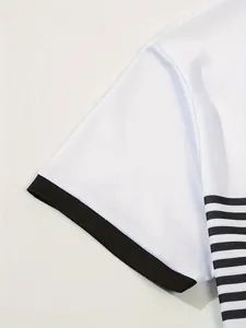 Close-up detail of white men's polo shirt featuring black ribbed cuff and side stripes