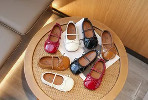 Collection of girls' patent leather Mary Jane shoes with delicate butterfly bows.