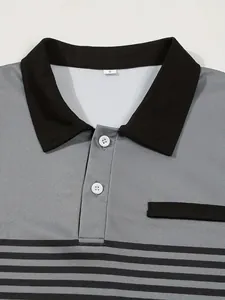 Detail view of grey and black striped men's polo shirt with white buttons and faux pocket