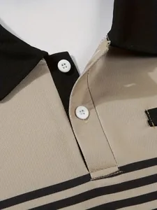 Close-up detail of khaki men's polo shirt showing white buttons and fabric texture.