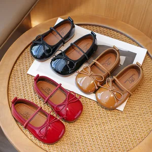 Elegant girls' patent leather Mary Jane flats with bow detail in black, red and tan
